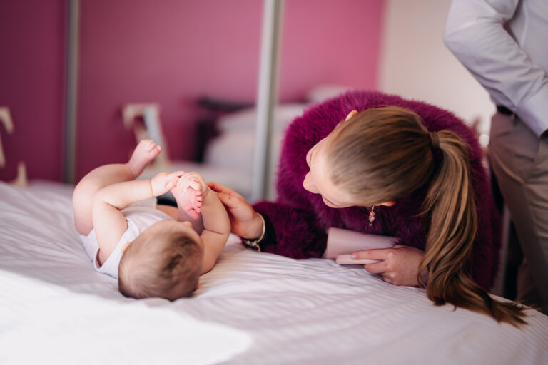 Baby sharing a candid moment with family before her christening