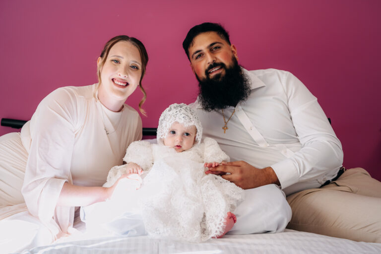 Family portrait with baby dressed for her Sydney christening