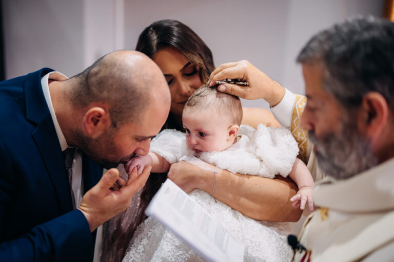 Baby being baptised with holy water during a Sydney christening