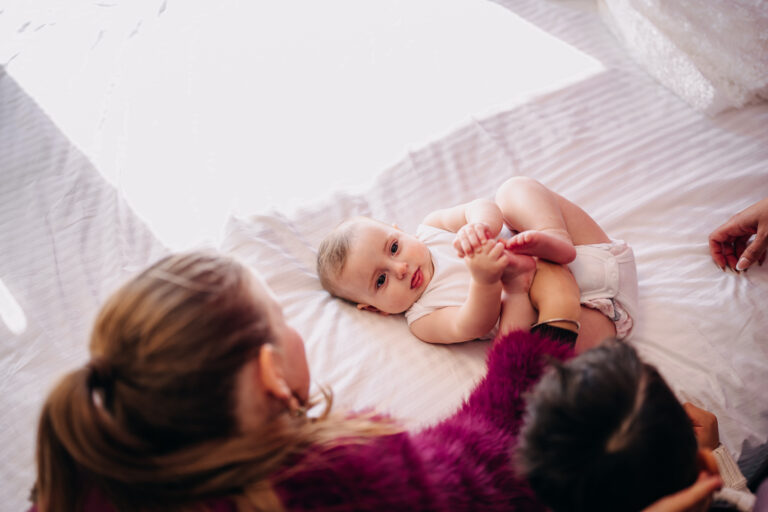 Candid family moment while preparing baby for her christening