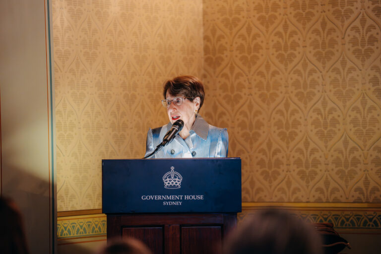 Female speaker addressing guests at a formal ceremony at Government House Sydney